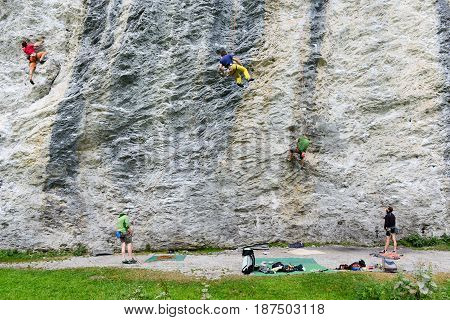 People Climbing On The Rock At Engelberg
