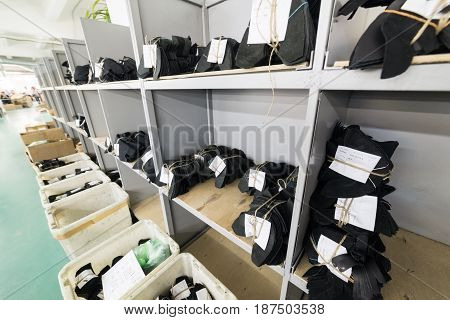 MOSCOW, RUSSIA - FEBRUARY 21, 2017: Moscow shoe factory JSC RALF RINGER. Cutting of leather parts in a plastic boxes. Shoe factory