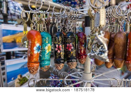 HERAKLION GREECE - JULY 09 2016: Crete. Traditional Cretan souvenirs and gifts. Trinket in the form of a wooden penis. Heraklion - the largest city on the island.