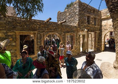 CRETE GREECE - JULY 11 2016: Tourists on Spinalonga island and fortress of the same name. Tourists on tours in the fortress.