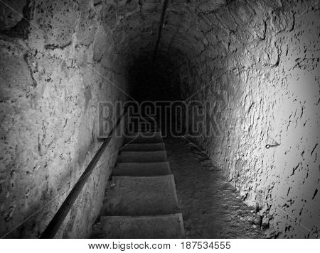 dark steps descending down a passage or tunnel