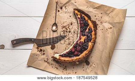 Top View Of Cheesecake On The Kraft Paper On The White Boards