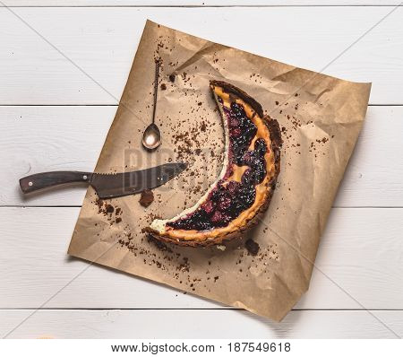 Top View Of Cheesecake On The Kraft Paper On The White Boards
