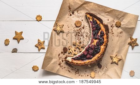 Top View Of Cheesecake With Cookies In The Form Of Stars On White Boards