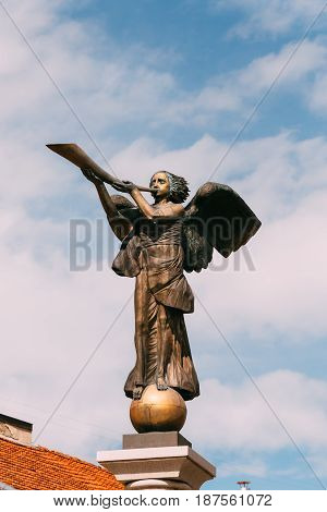 Vilnius, Lithuania. Statue Of An Angel Blowing A Trumpet In Main Square Against A Sunny Blue Sky In Uzupis District. Uzupio Republic Or Uzupis Is A Cultural Artistic District, Popular Tourist Place