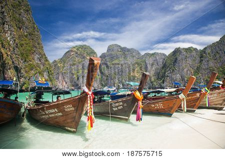 KO PHI PHI LEH, THAILAND, February 1, 2014: Traditional long tail boats on the beach of Maya Bay, Andaman Sea, famous tourist destination in the Ko Phi Phi achipelago