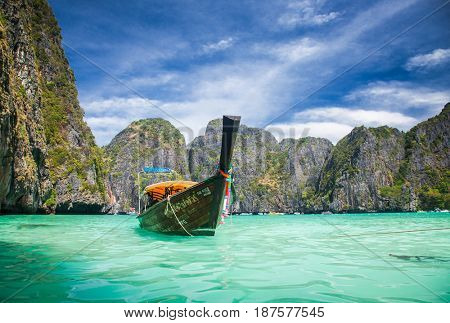 KO PHI PHI LEH, THAILAND, February 1, 2014: Traditional long tail boats on the beach of Maya Bay, Andaman Sea, famous tourist destination in the Ko Phi Phi achipelago