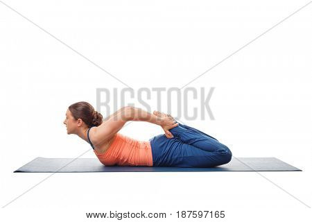 Woman doing Hatha Yoga asana Bhekasana or frog pose isolated on white background