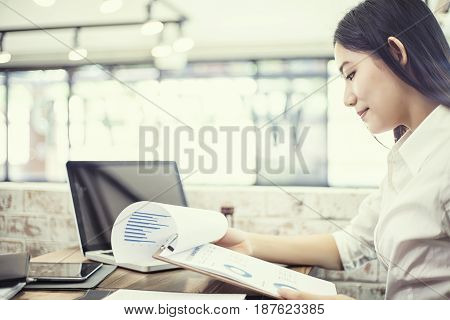 Business businesswoman using laptop working in office Business concept soft focus