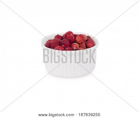 Wild small strawberries in a bowl. Ripe and tasty strawberries isolated on white background. Sweet and juicy berry with copy space for text.