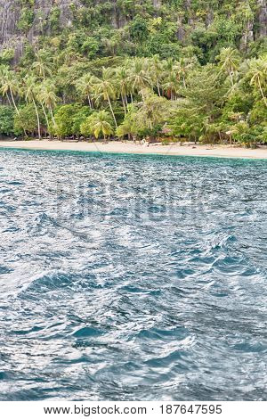 View From A Boat Of  Palm Cliff Beach And Rock