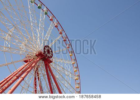 Carnival Ferris Wheel with Clean Skies with Empty Space Close up shot of half of a ferris wheel Copy space