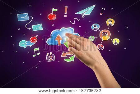 Female hand toucing mixed media icons with purple background