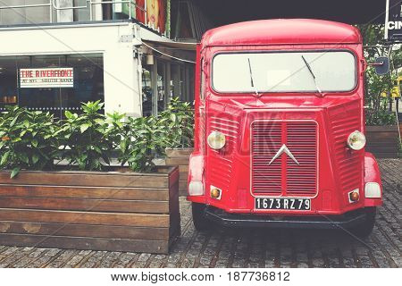 London, UK - 29 Sept 2016: Restored H-type Citroen delivery van parked on the South Bank of the Thames in London, UK. Mid 20th Century vintage vehicle with matte, retro filter applied.. 