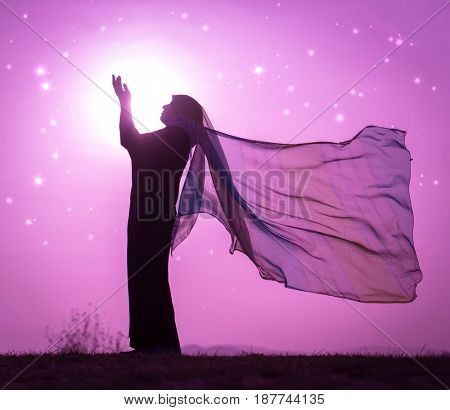  Copy space of silhouette woman rising hands on sunset sky double exposure colorful bokeh and bird fly background. Vintage tone filter effect color style.