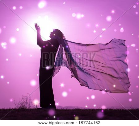  Copy space of silhouette woman rising hands on sunset sky double exposure colorful bokeh and bird fly background. Vintage tone filter effect color style.