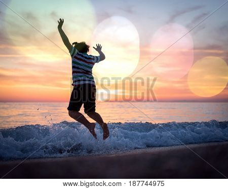 Happy boy enjoying the beach