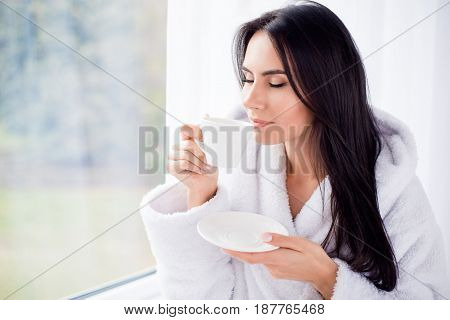 Good Morning! Close Up Portrait Of Charming Dreamy Brunette Young Girl Drinking Coffee. She Is Sleep
