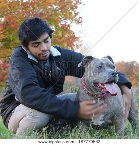 Young man and his dog in the outdoors