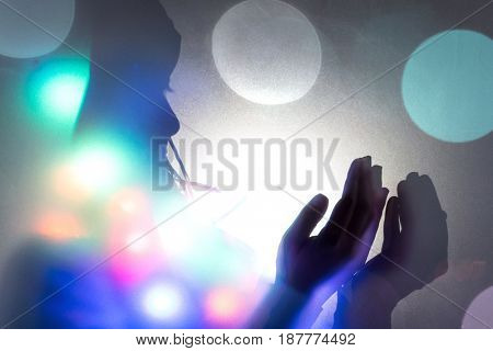 Muslim woman hands up for prying,  colorful  and  vintage tone filter effect color style.