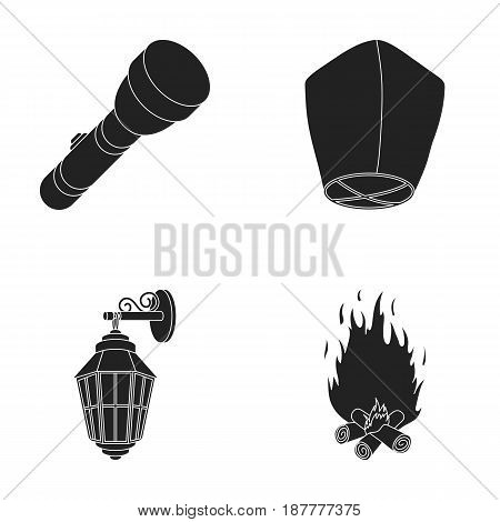 A flashlight, an air lantern, a lantern on the wall, a bonfire.Light source set collection icons in black style vector symbol stock illustration .
