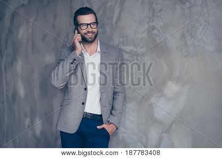 Close Up Of A Cheerful Businessman Who Is Smiling, Talking To Businesspartner About Success Of The C