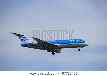 Amsterdam the Netherlands - July 21st 2016: PH-KZR KLM Cityhopper Fokker F70 approaching Polderbaan runway at Schiphol Amsterdam Airport arriving from Norwich United Kingdom