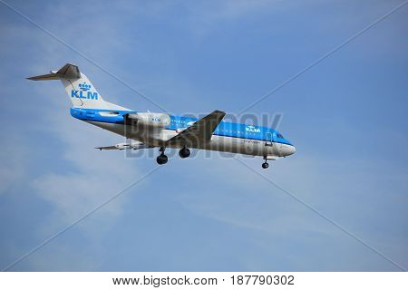 Amsterdam the Netherlands - July 21st 2016: PH-KZK KLM Cityhopper Fokker F70 approaching Polderbaan runway at Schiphol Amsterdam Airport arriving from Belfast Ireland