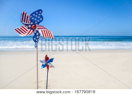 Patriotic USA background with decorations on the sandy beach