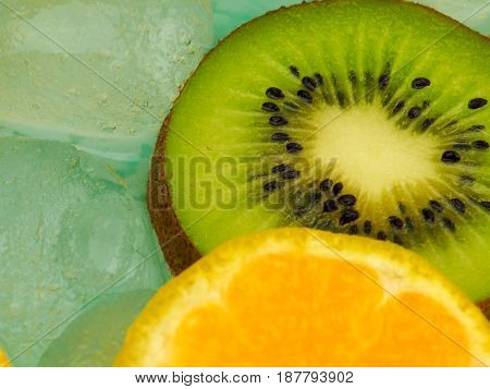 Fresh orange macro in ice cubes background.