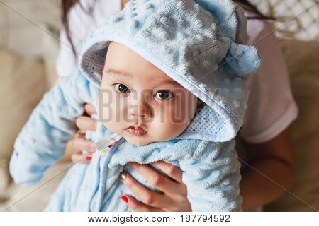 Portrait of a little adorable newborn infant asian baby.