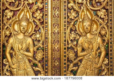 Beautiful golden carving on the door of Wat Sensoukharam temple in Luang Prabang, Laos