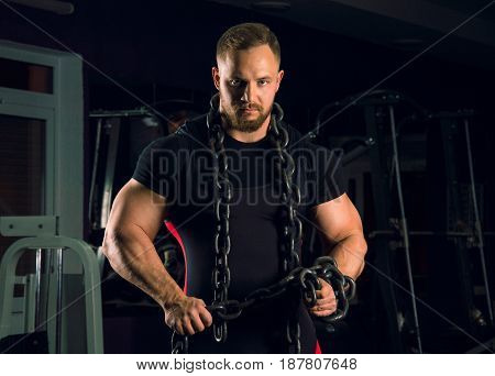 Strong Athlete Is Wearing Bench Equipment With A Chain Around His Neck