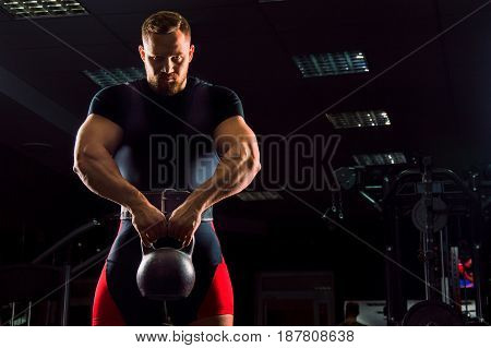 Huge Weightlifter Stands With A Weight In His Hands
