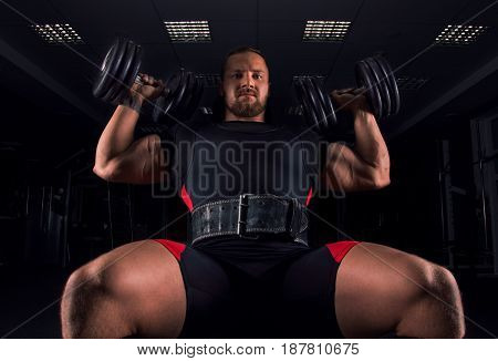 The Athlete Sits On A Bench And Does An Exercise Called Military Press