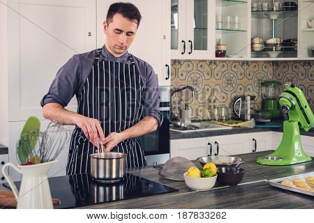 Chef cook working on a modern kitchen at home