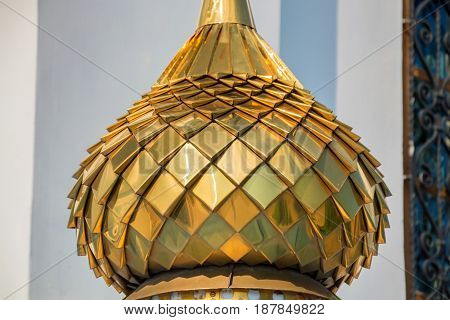 Closeup image of golden bulbous dome of Russian Orhodox church