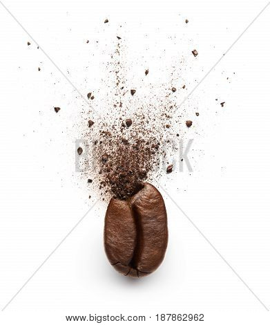 Coffee powder burst from coffee bean isolated on white background