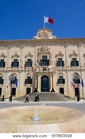 VALLETTA, MALTA - MARCH 30, 2017 - View of the Auberge de Castille in Castille Square with a fountain in the foreground Valletta Malta Europe, March 30, 2017.