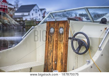 Front View of Upper Deck with Steering on Small Yacht Moored to Pier at Lofoten Islands in Norway.Horizontal Shot
