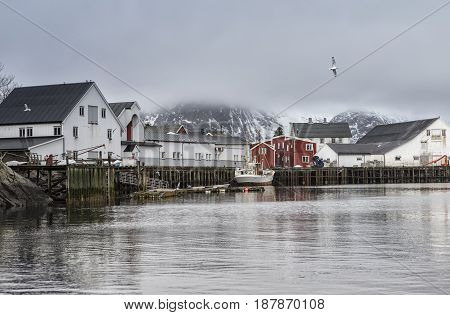 Cold Snowy Norwegian Harbour Seascape View at Toppoya and Hamnoy Bays of Lofoten Islands.Horizontal Image Orientation