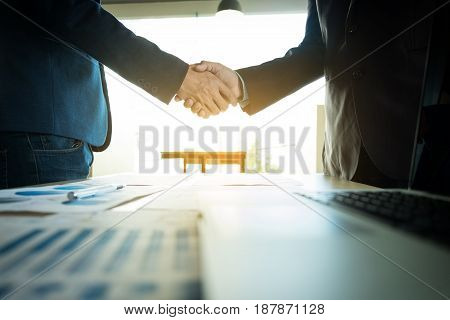 Business partnership meeting concept. Image businessmans handshake. Successful businessmen handshaking after good deal.