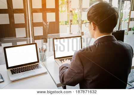 business man working document and laptop in office morning light. business concept.