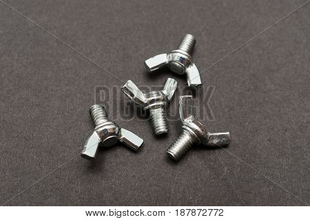 butterfly bolts on a black background horizontal