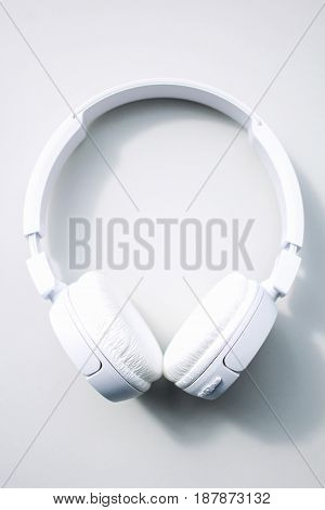 Modern white headphones Isolated on white background.