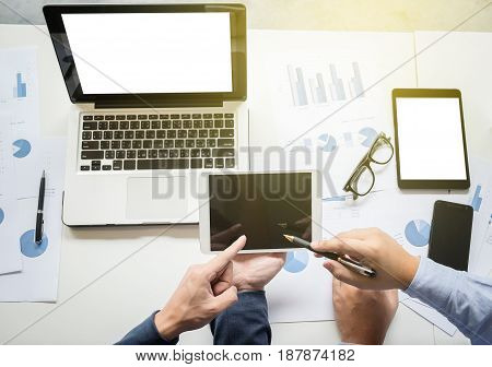 Businessteam working at office desk and using a digital tablet computer laptop and many documen new project plan of business.