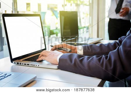 Two businessmen looking at report and having a discussion in office. business concept.