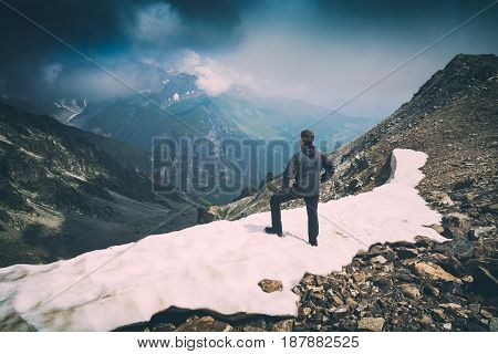 Hiker Stays On A Snow Mountain Hill. Instagram Stylization