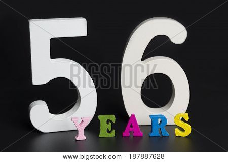 Letters And Numbers-fifty Six On A Black Background.