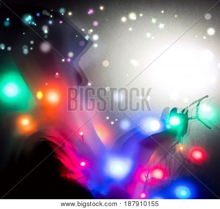 Muslim woman praying in dark room with nice lights around her